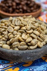 Green and roasted coffee beans from South America coffee producing region, from Colombia and Brazil with  mountain ranges and climate ideal for coffee growing