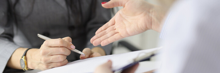 Businesswoman hands partner contract for signature closeup