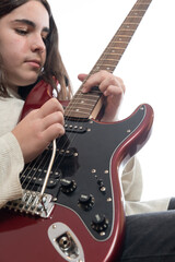Young man moves the tremolo and shakes his guitar while playing a rock solo.
