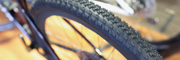 Reliable tire with quality tread on bicycle wheel closeup