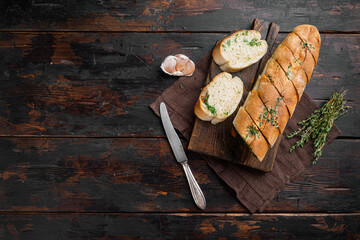 Homemade vegetarian sandwich cream cheese butter garlic bread, on old dark  wooden table...