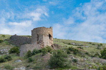 Fototapeta na wymiar View tower of Chembalo fortress. Medieval architecture monument, landmark. Ruined stone Genoese fortress in Balaclava in Crimea