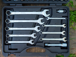 Close-up of a set of repair wrenches in a box. A set of tools. Top view, flat lay