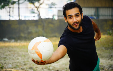 Young football Player having ball image in hand