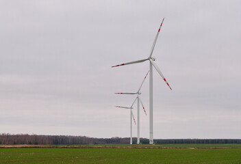Wind energy plant under cloudy sky