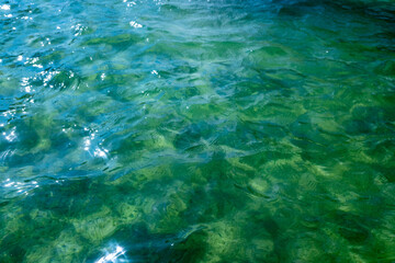 Fototapeta na wymiar Blue-green in the light of the sea water.