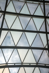 Metal frame made of glass on the roof, transparent ceiling background.