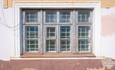 Old wooden windows in the house, close-up.