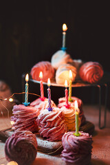 Russian homemade berry zephyr on dark background with birthday candles. Russian sweetness cusine