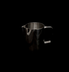 Metal mug isolated on black background