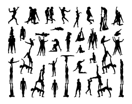 Collection of black silhouettes of acrobats and gymnasts isolated on a white background.