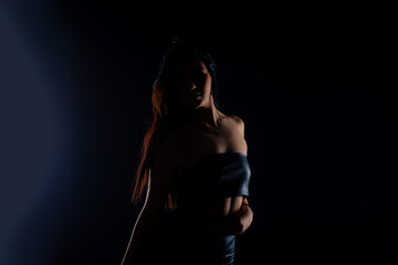 Obraz premium Silhouette posing in all black clothes