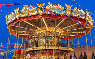 Christmas carousel with illumination and toys