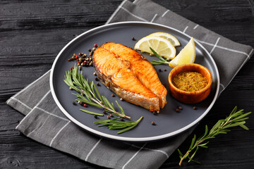 baked salmon steak on a plate, top view
