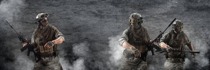 Three mercenary soldiers during a special operation in the smoke against the background of a dark concrete wall - photo with copy space in center. Format photo 3x1. - obrazy, fototapety, plakaty