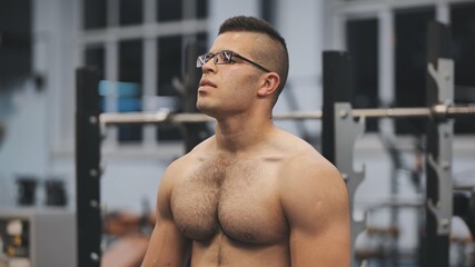 Fototapeta na wymiar Muscular arab man posing in the gym.