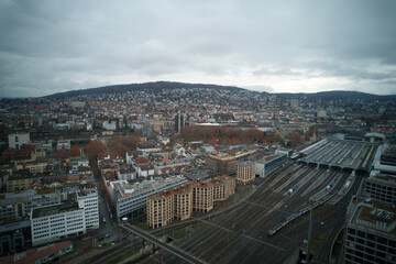 Aerial view of City of Zürich with railway main station and track field on a cloudy grey autumn day. Photo taken November 28th, 2021, Zurich, Switzerland.
