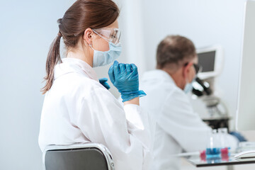 close up. female scientist sitting at a laboratory table.