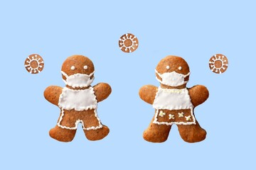 Cute gingerbread couple with protective face masks and coronaviruses, isolated, blue background