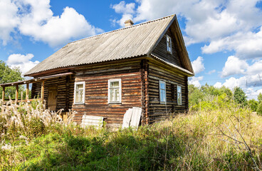 Fototapeta na wymiar Old abandoned rural wooden house in russian village