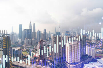 Forex and stock market chart hologram over panorama city view of Kuala Lumpur. KL is the financial center in Malaysia, Asia. The concept of international trading. Double exposure.