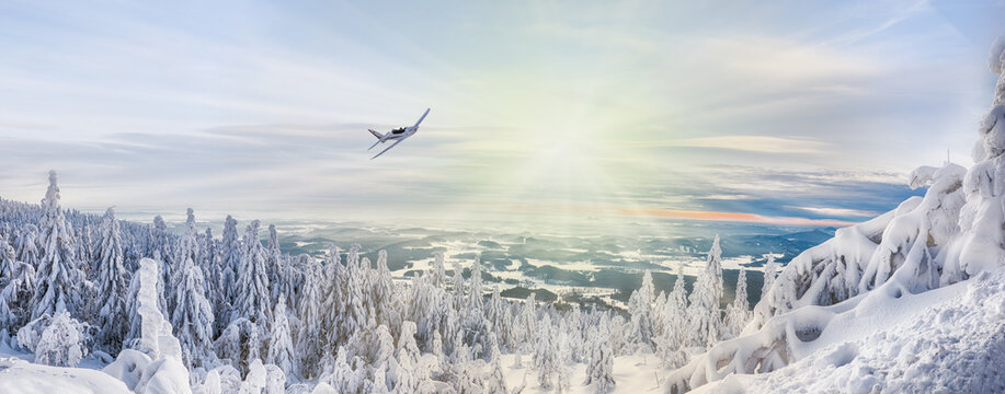 beautiful winter view of the valley from Je&scaron;těd and sunset with a plane