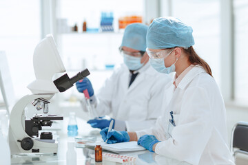close up. scientists conduct research in a modern laboratory .