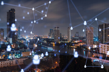 Glowing social media icons on night panoramic city view of Bangkok, Southeast Asia. The concept of networking and establishing new connections between people in businesses. Double exposure.