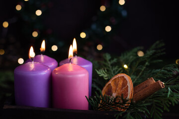 Four purple advent candles in Christmas eve.