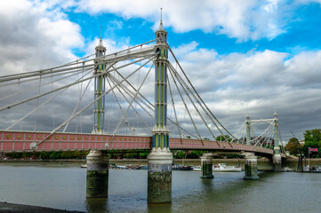 Albert Bridge, a road bridge over the Tideway of the River Thames connecting Chelsea to Battersea in London, UK.