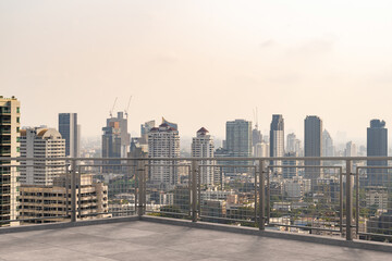 Obraz premium Panoramic Bangkok skyline view, concrete observatory deck on rooftop, daytime. Luxury Asian corporate and residential lifestyle. Financial city downtown, real estate. Product display mockup empty roof