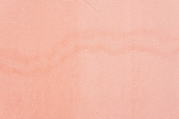 Old plastered wall with, spots. Coral color grunge texture. Abstract background