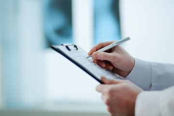 close-up. doctor filling out a medical form. - 471899028