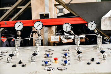 Hydraulic oil station control system with pressure gauges and pressure switch buttons.