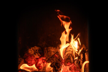 A fire burns in a fireplace. Fire to keep warm.