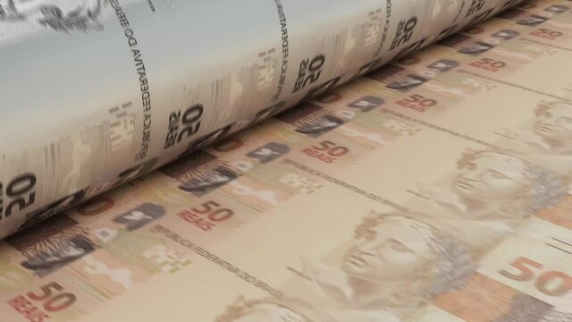 A 4K seamless looping animation concept image showing a long sheet of brazilian real notes going through a print roller in its final phase of a print run	