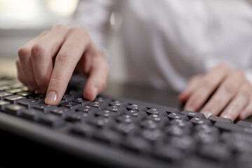  Female hands or woman office worker typing on the keyboard