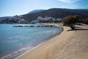 Obraz premium Secluded Sikinos island Greece. Beautiful quiet beach in a beautiful bay on a summers day. Landscape aspect shot with copy space.