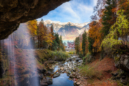 View of Lake Brienz below the Giesbach Waterfall surrounded by autumn trees.