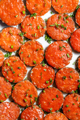 Snacks made of rye bread, spread with sauce and sprinkled with green onions. Flat layout.