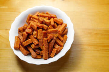 Delicious croutons are on a plate. Appetizer for beer.
