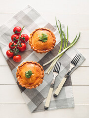 Tasty beef pot pies on table