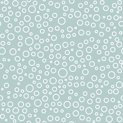 Seamless vector background with random white circles. Abstract ornament. Dotted abstract pattern