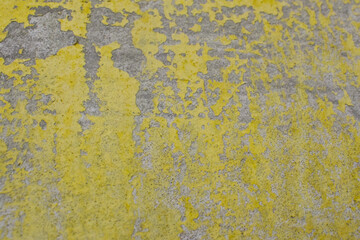 Yellow and Gray Dirty Plaster Wall, With Falling Off Flakes Of Paint. Rough Surface. Peeled Plaster. High quality photo