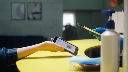 Vaccination passport qr code control, woman checking on phone European coronavirus covid 19 vaccine passport to enter cafe, restaurant. Tourist show international certificate in airport terminal.