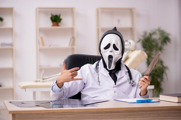 Devil doctor working in the clinic