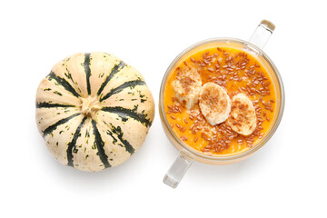 Pot of tasty oatmeal with pumpkin and banana on white background