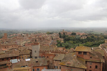 Fototapeta na wymiar Panorama dal Facciatone, panoramic view of Siena, Italy of church facade, and centuries-old towers & piazzas.