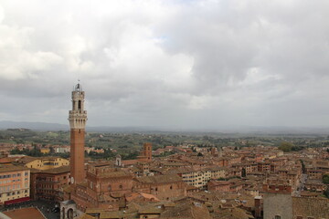 Fototapeta na wymiar Panorama dal Facciatone, panoramic view of Siena, Italy of church facade, and centuries-old towers & piazzas.