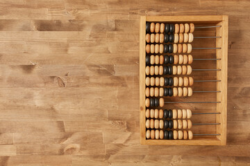 old-fashioned abacus on a wooden table top view